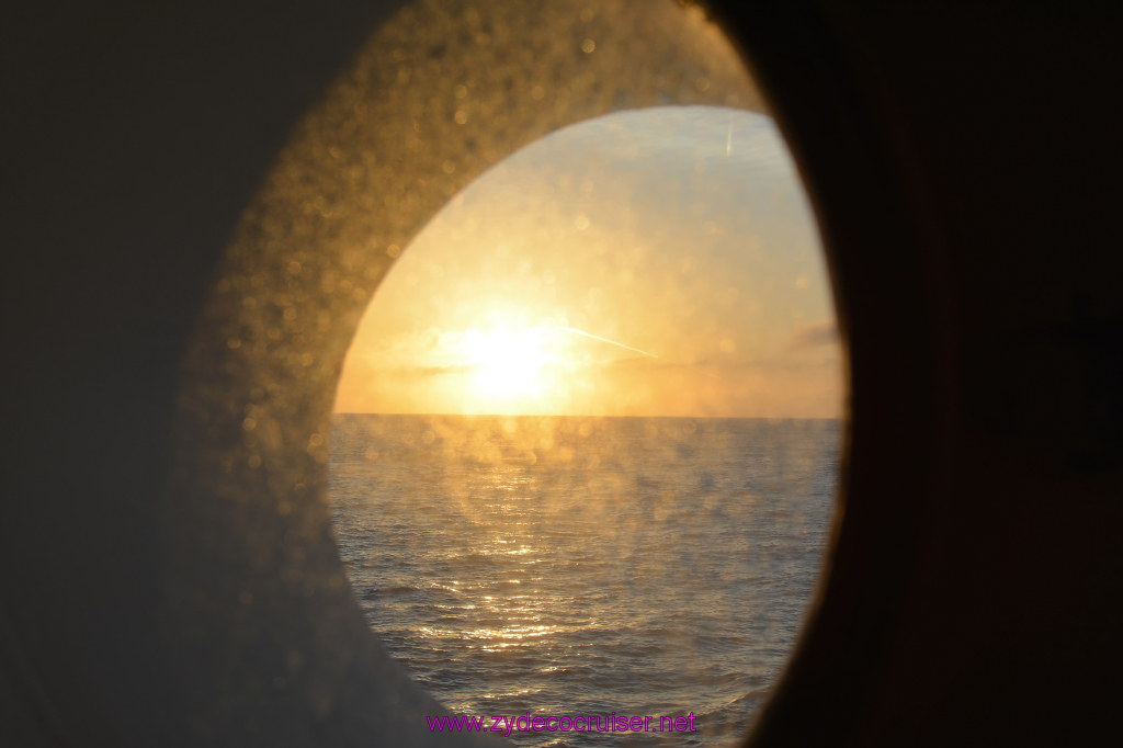 001: Carnival Imagination, Catalina, Sunrise through a dirty porthole