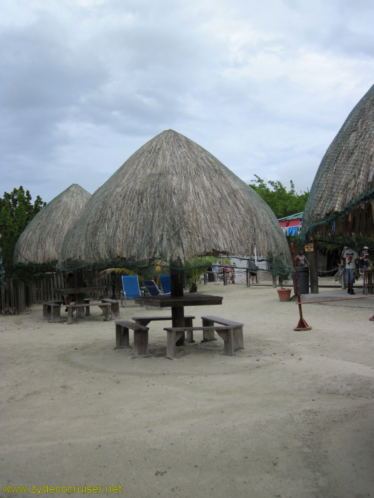 071: Carnival Conquest, Roatan, Mahogany Beach, Palapas at far end at El Hideaway Bar and Restaurant, 