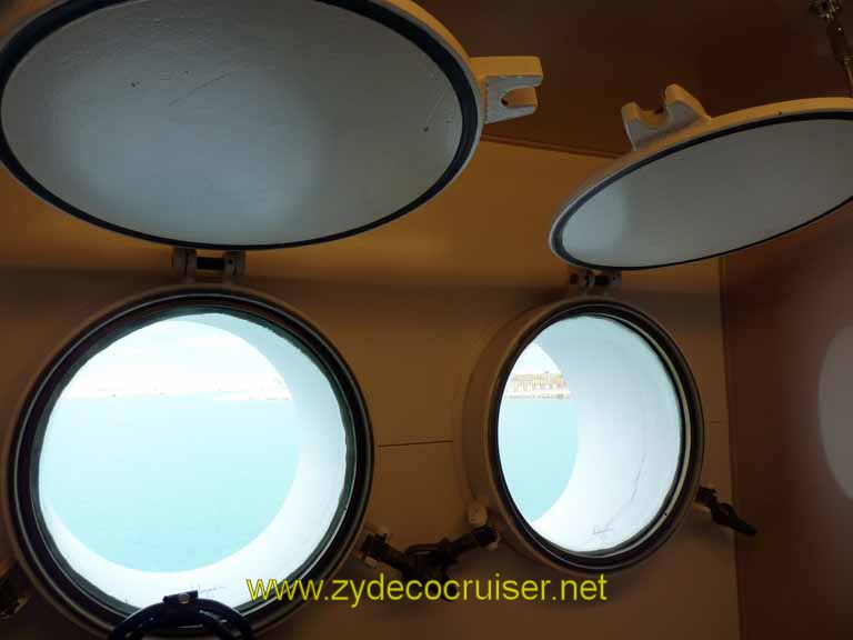 214: Carnival Sensation, Freeport, Bahamas, the porthole covers do open